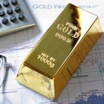 Gold bullion barr on a stocks and shares chart